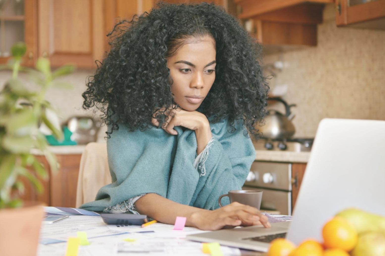Clean workspace with financial planning materials and laptop
